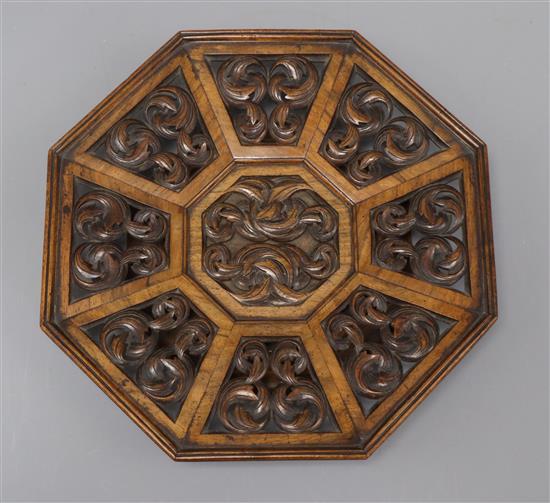 A 19th century carved walnut octagonal dish length 26cm
